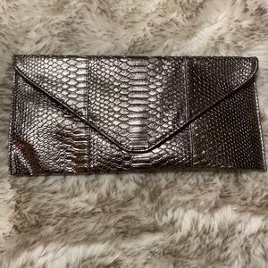 Never used large metallic clutch bag